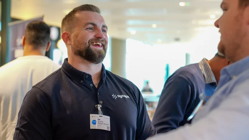 Synapx team member in conversation